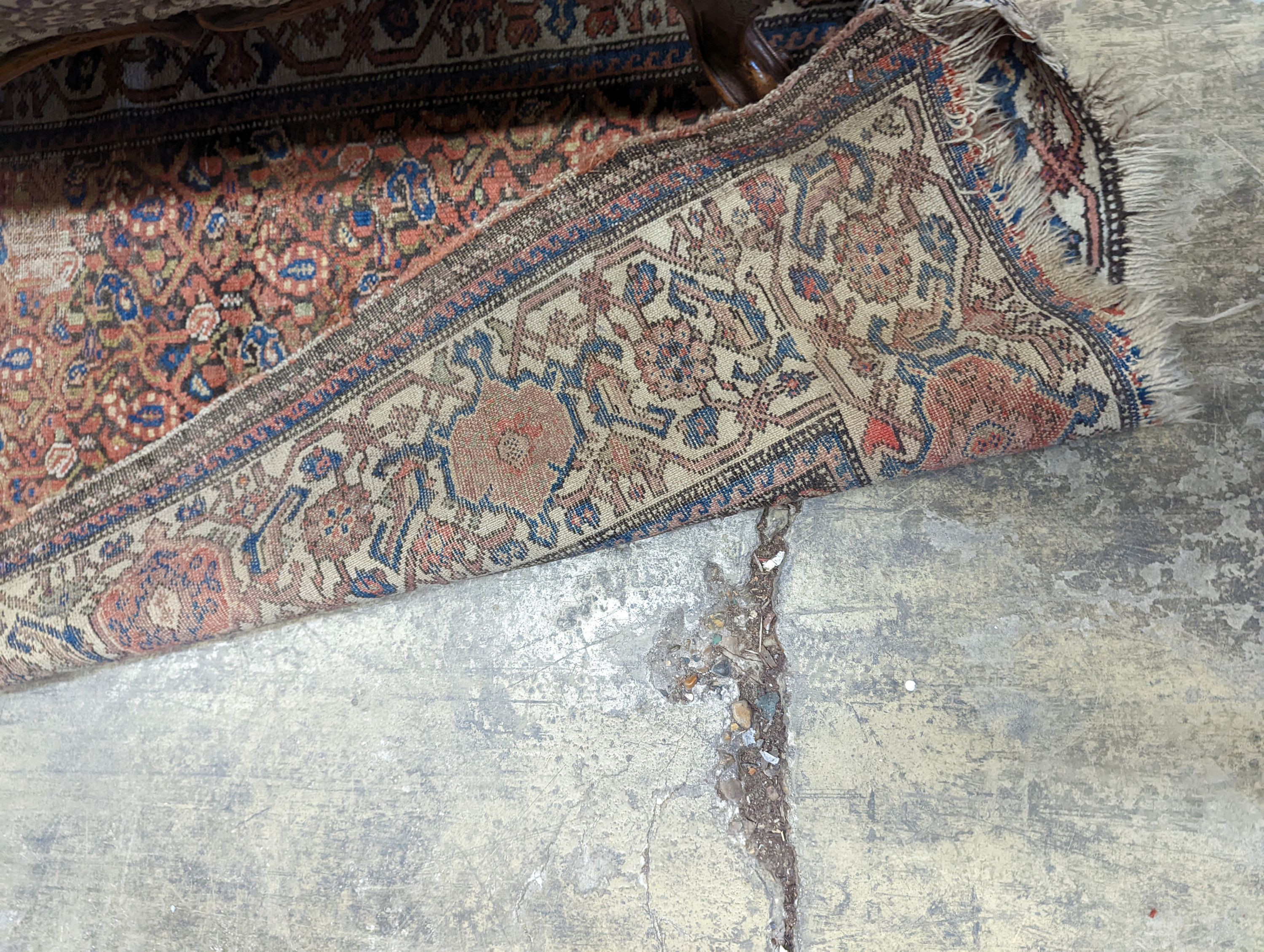 A Persian black ground runner, the central field including boteh motifs, 280 x 106cm, worn